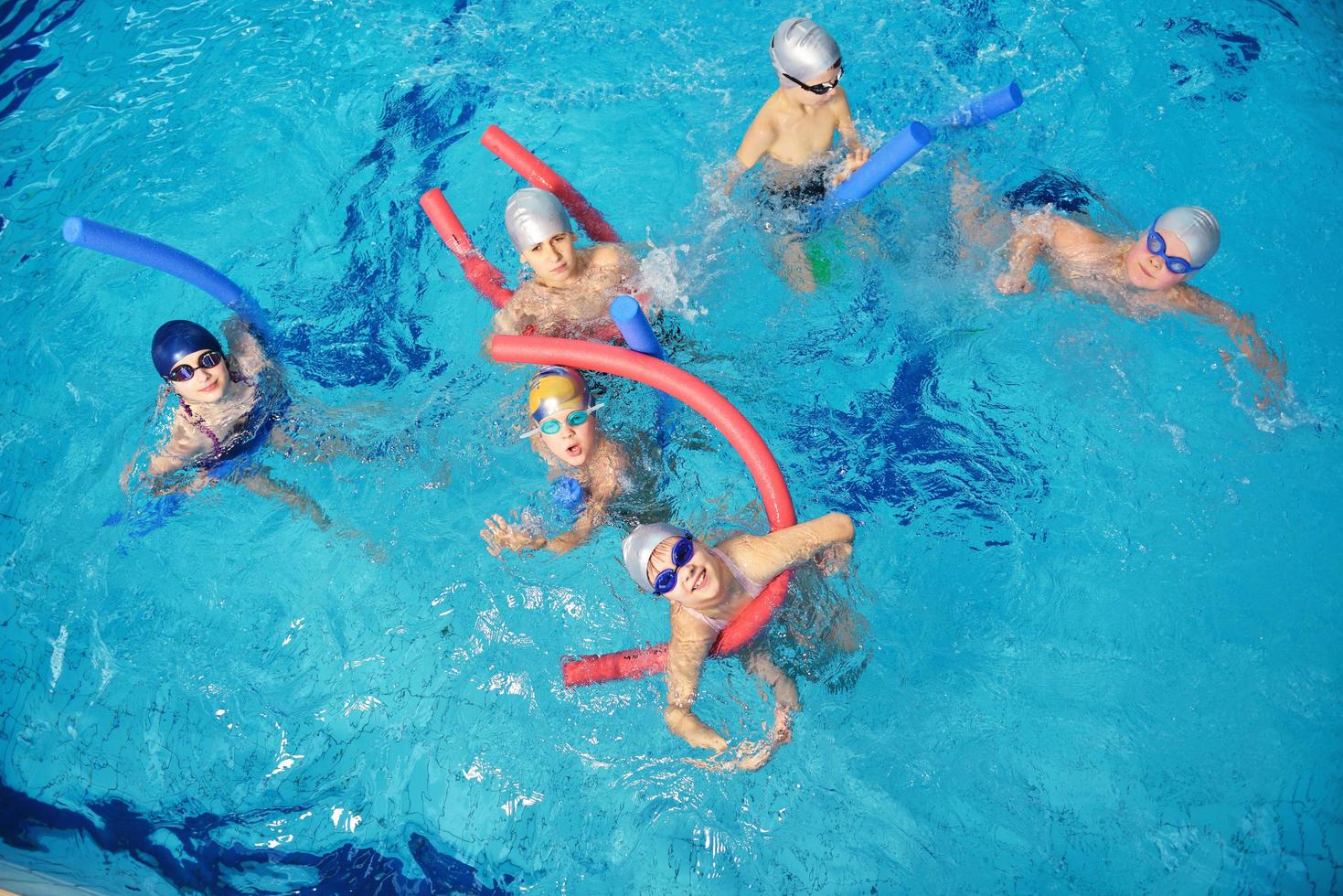 happy children group  at swimming pool photo