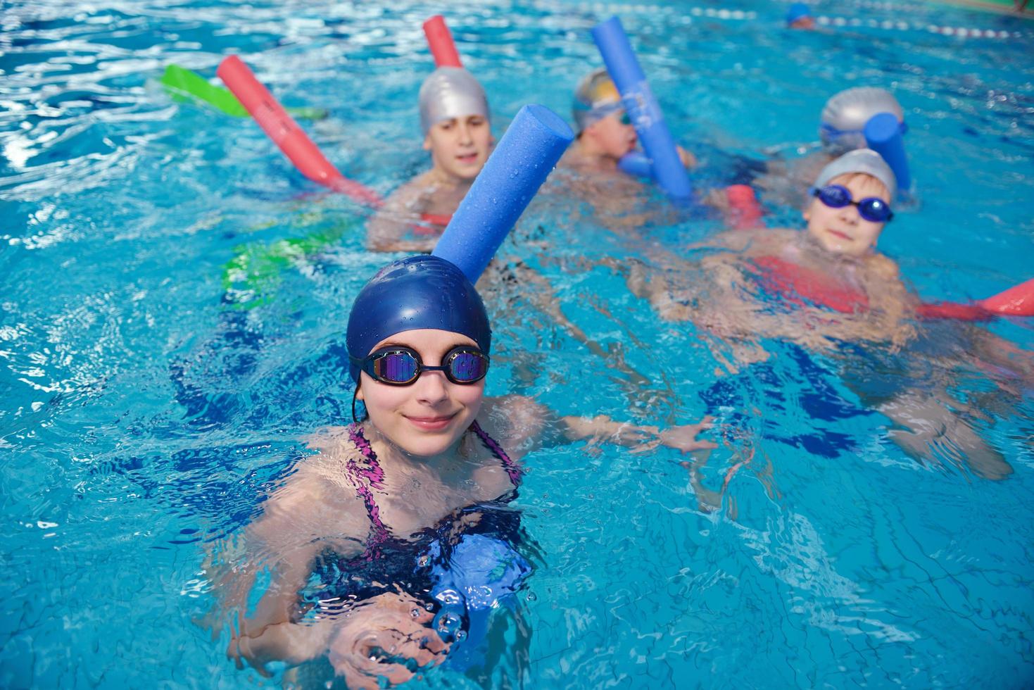 happy children group  at swimming pool photo