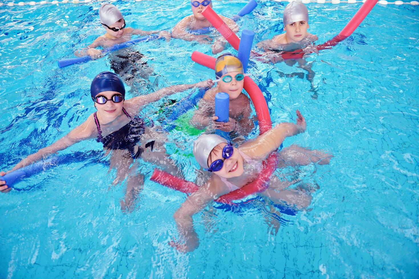 happy children group  at swimming pool photo