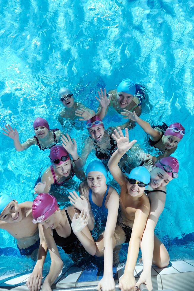 happy children group  at swimming pool photo