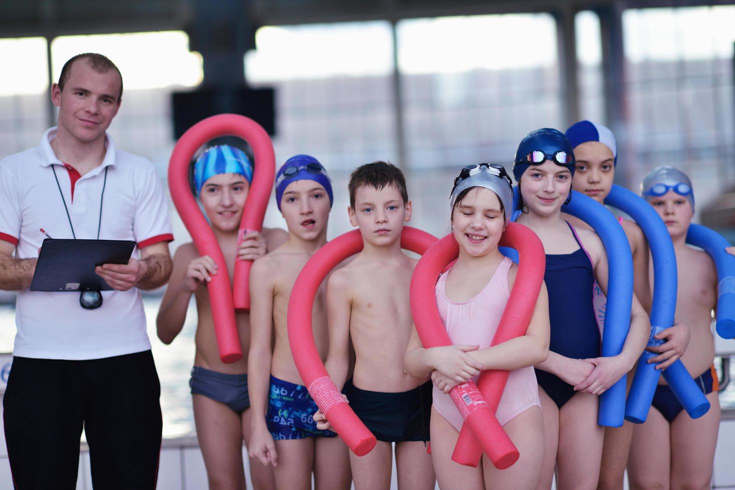 happy children group  at swimming pool photo