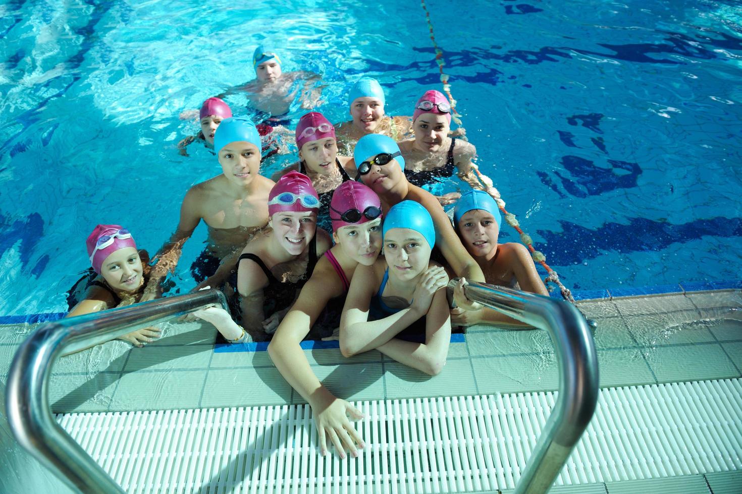 happy childrens at swimming pool photo