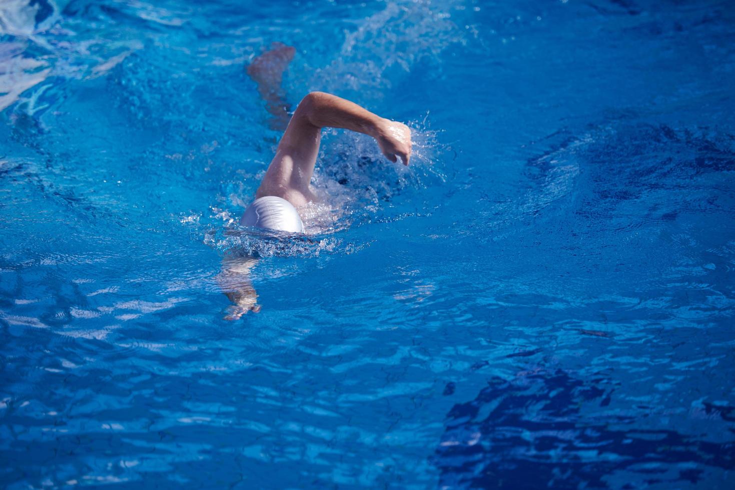 swimmer excercise on indoor swimming poo photo