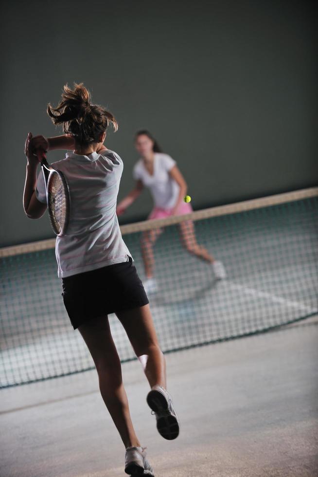 Playing tennis indoors photo