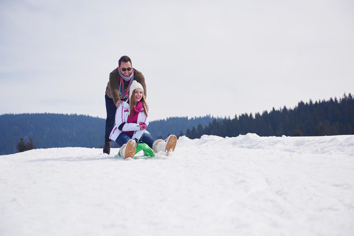 happy young couple having fun on fresh show on winter vacation photo