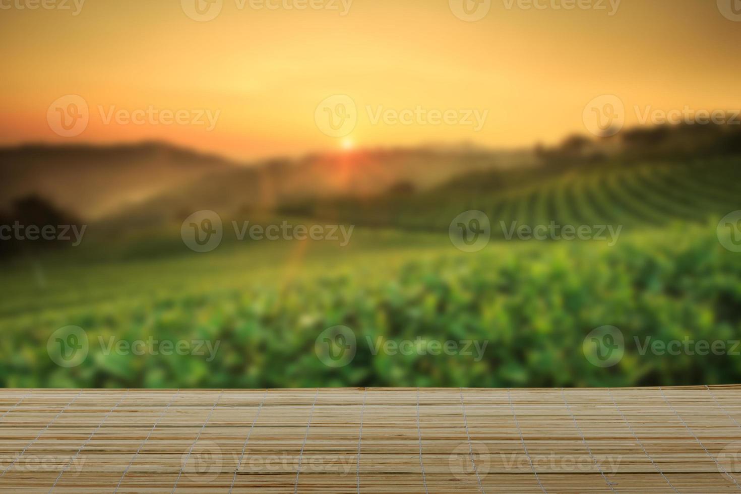 Empty wooden table with view of mountain or wooden desk with plantation nature with bokeh background, copy space for your text photo