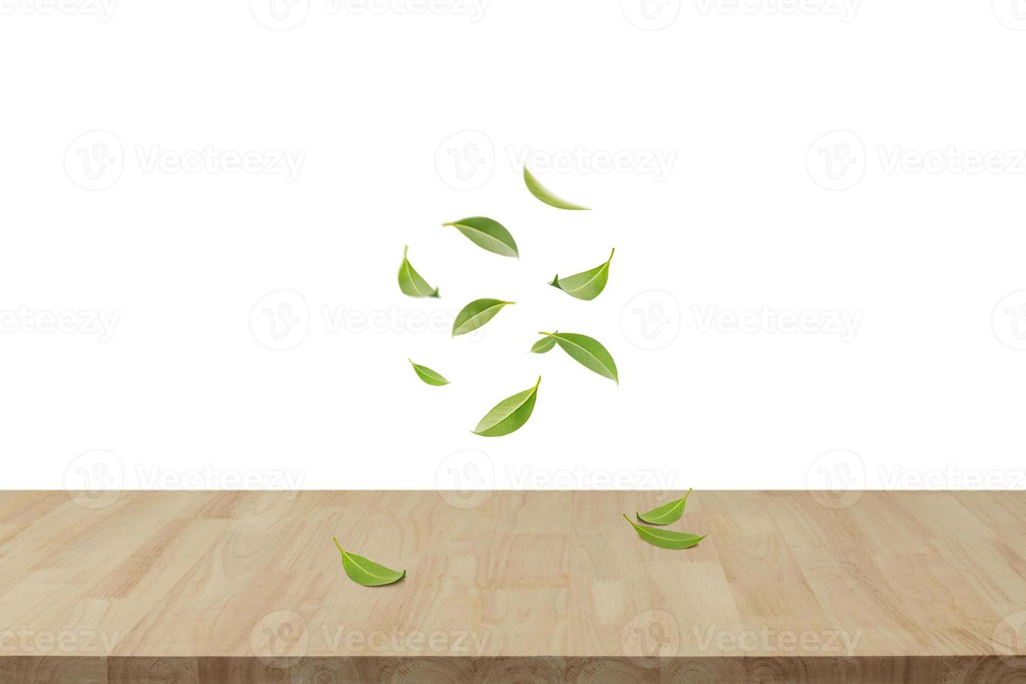 Flying whirl green leaves in the air with wooden table, Healthy products by organic natural ingredients concept, Empty space in studio shot isolated on white background long banner photo