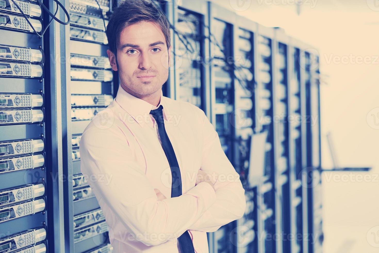 young it engeneer in datacenter server room photo