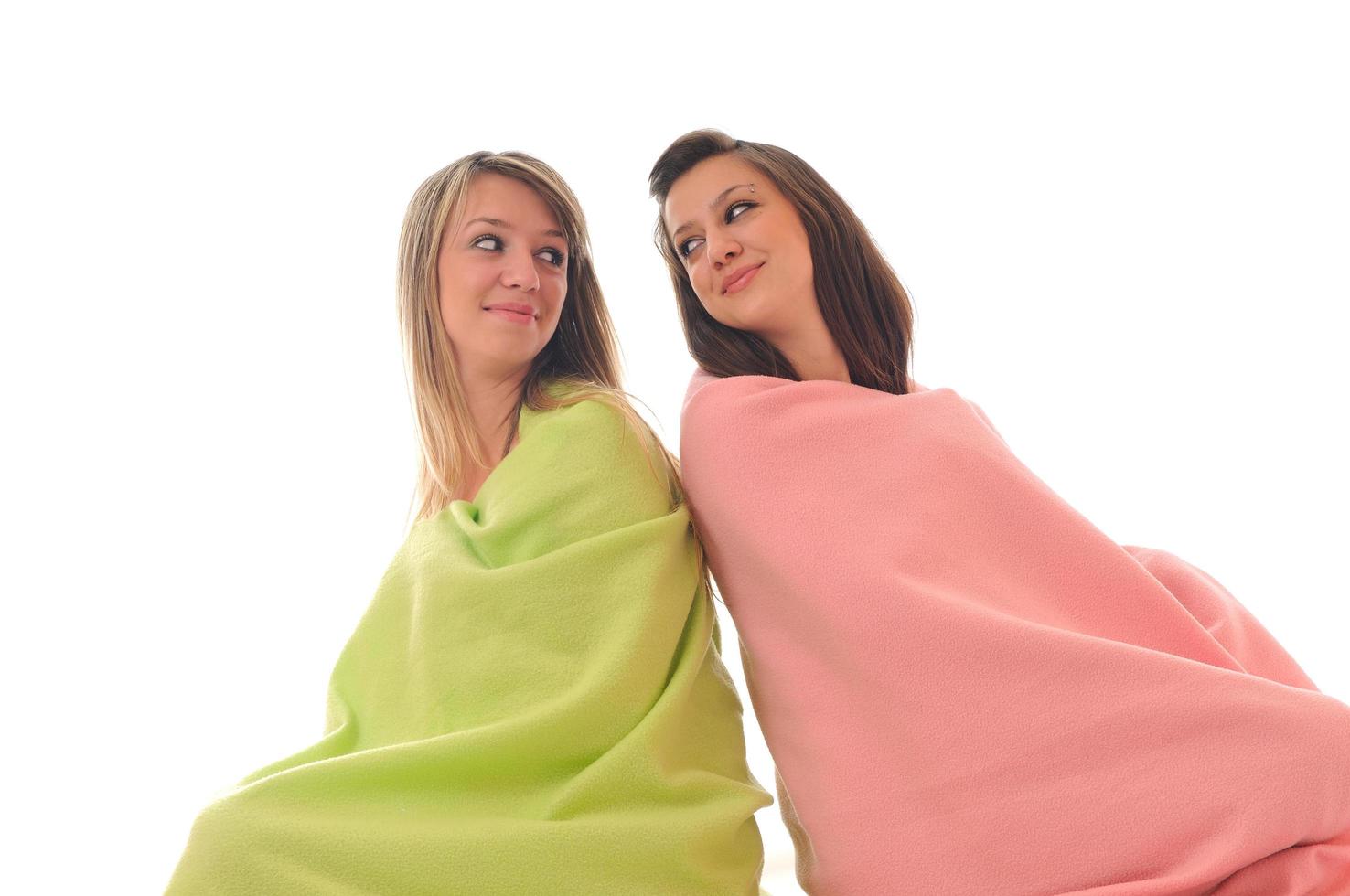 young girls under blanket smile photo