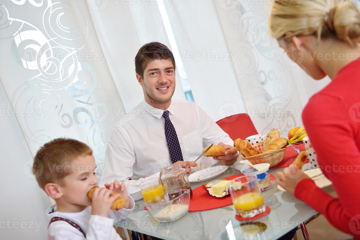 family have healthy breakfast at home photo