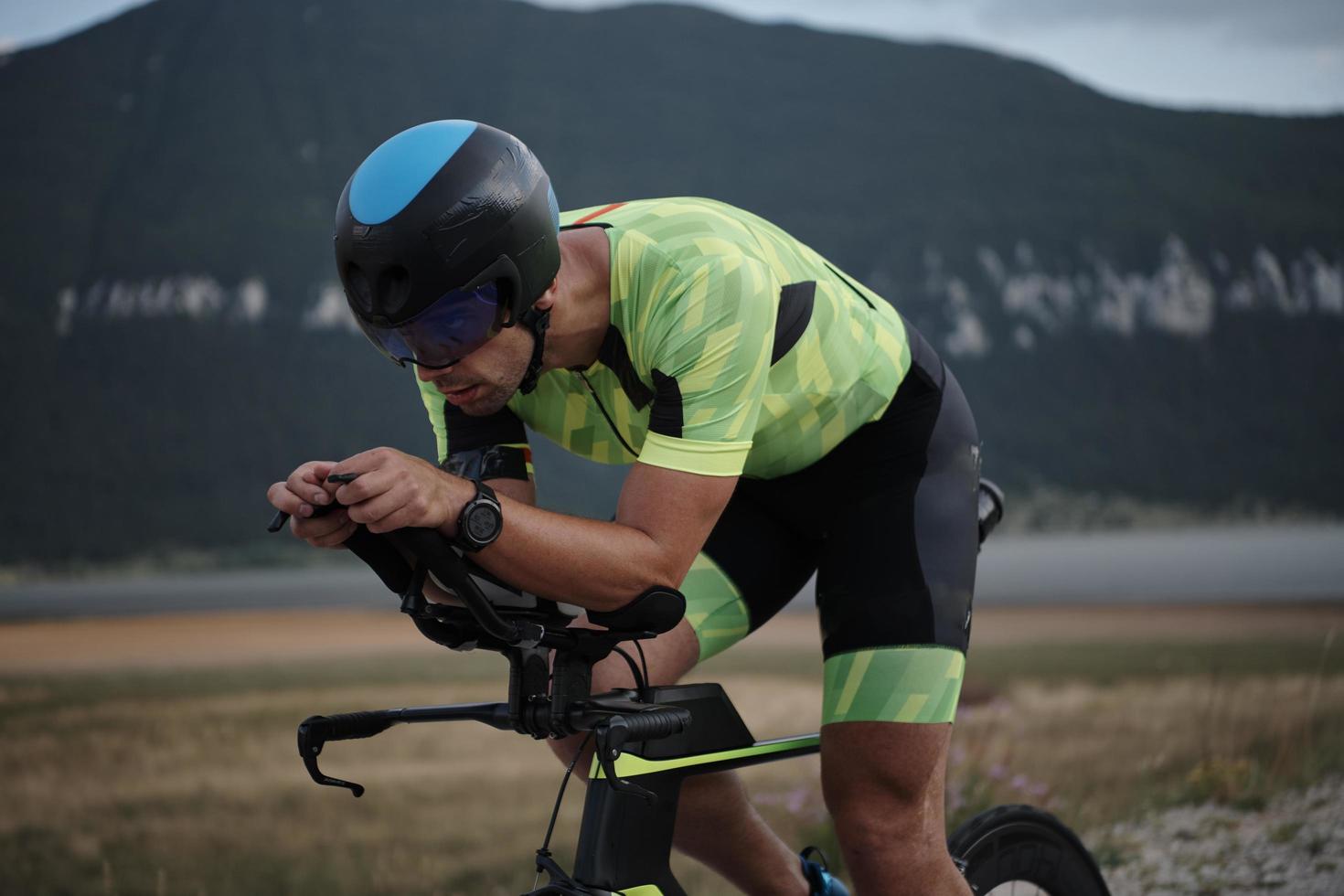 triathlon athlete riding bike photo