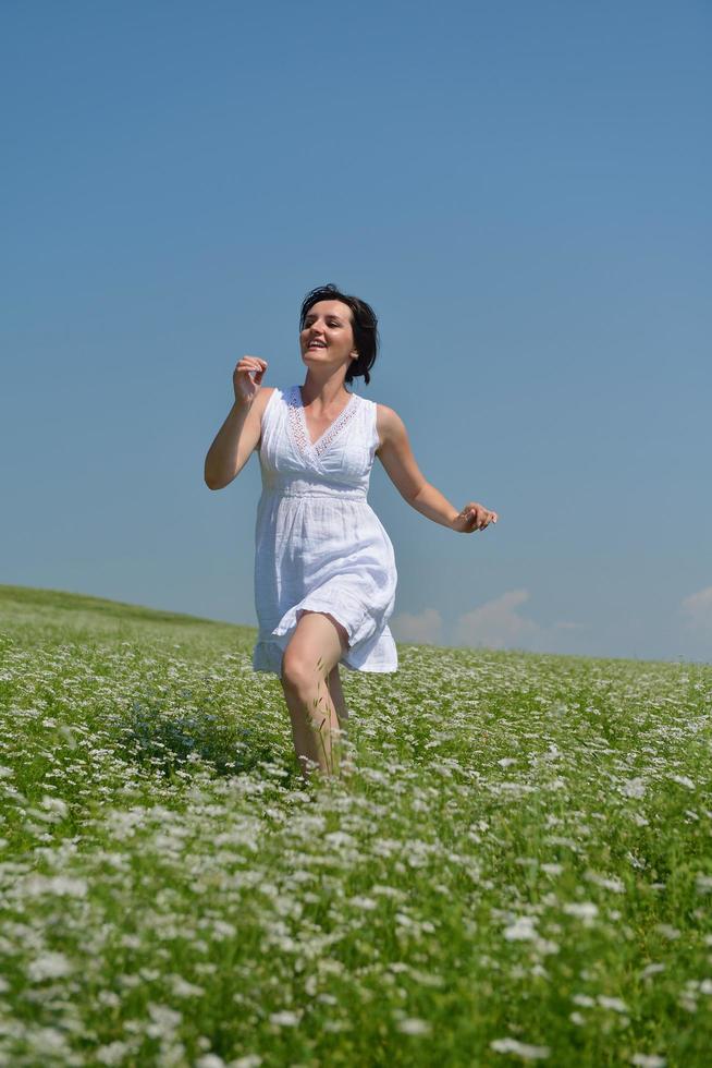 Young happy woman in green field photo