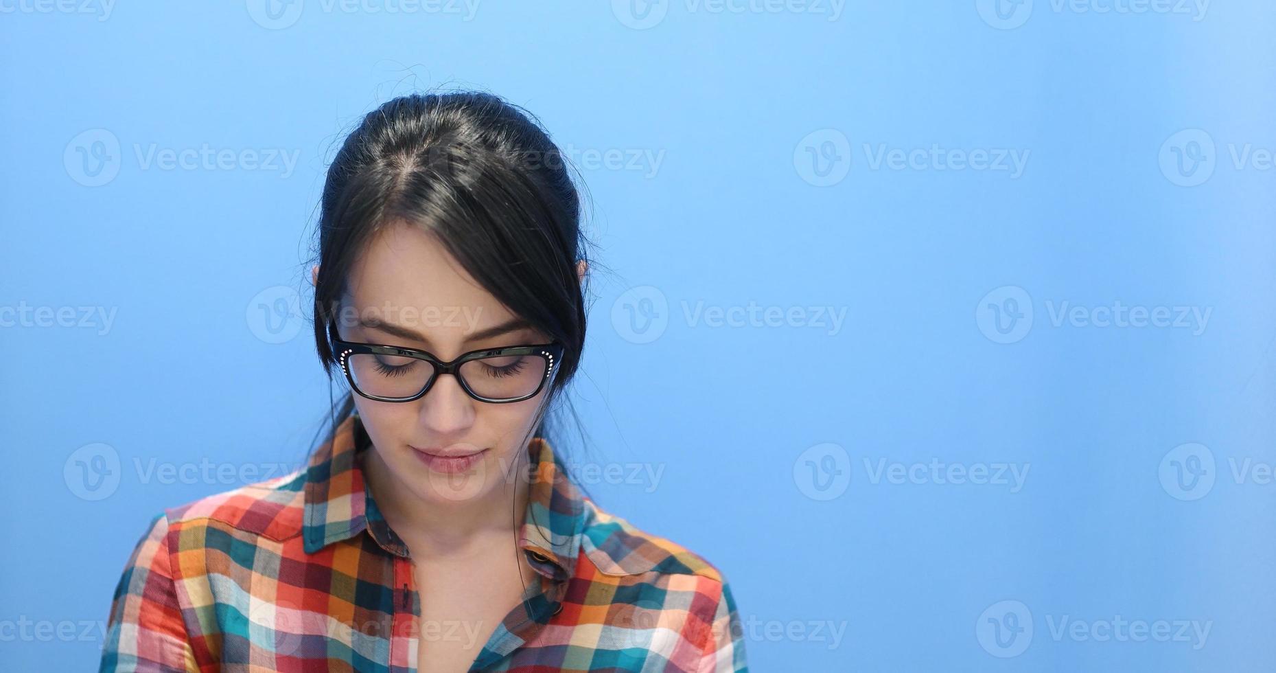 woman smiling wearing on a pair of large glasses photo