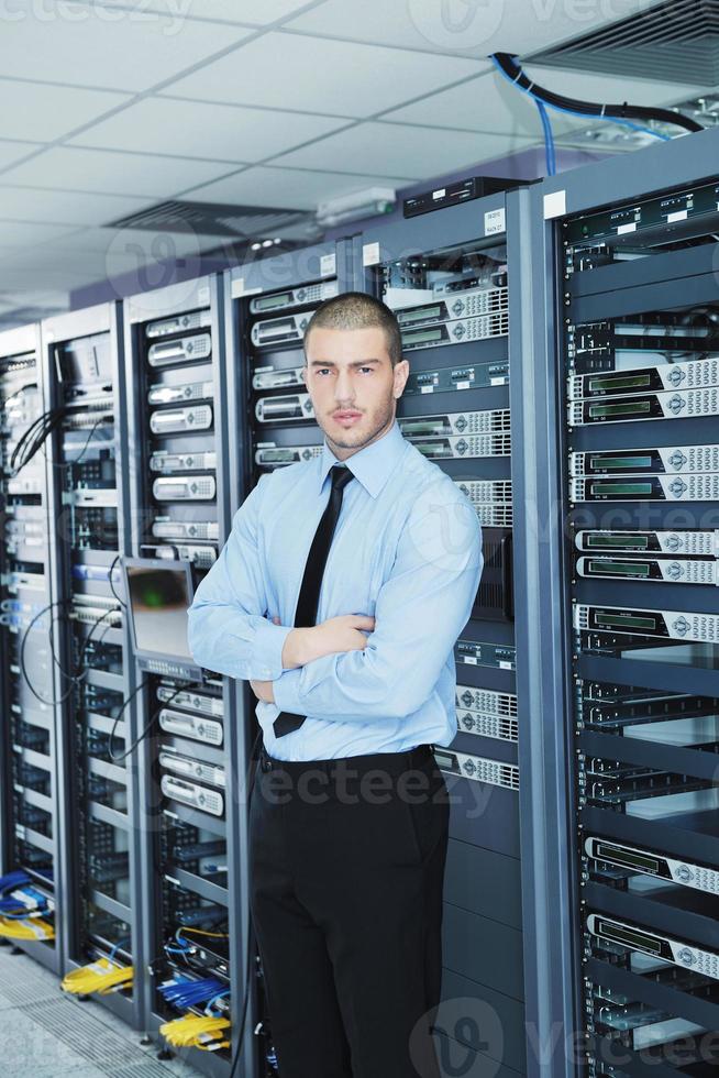 young it engeneer in datacenter server room photo