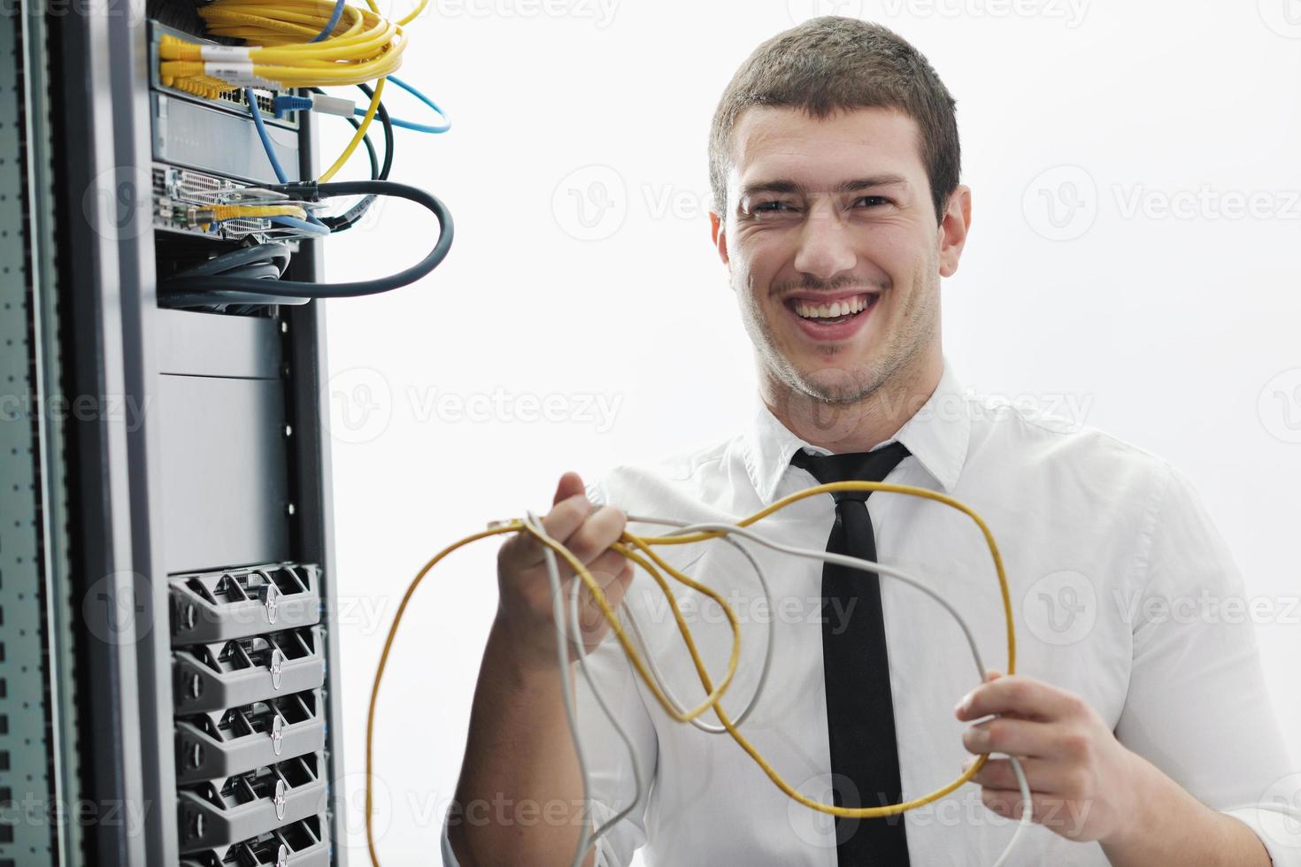 young it engeneer in datacenter server room photo