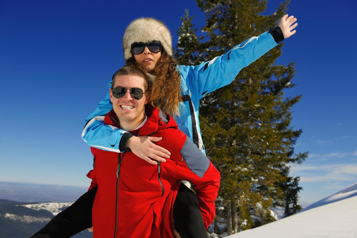 young couple on winter vacation photo