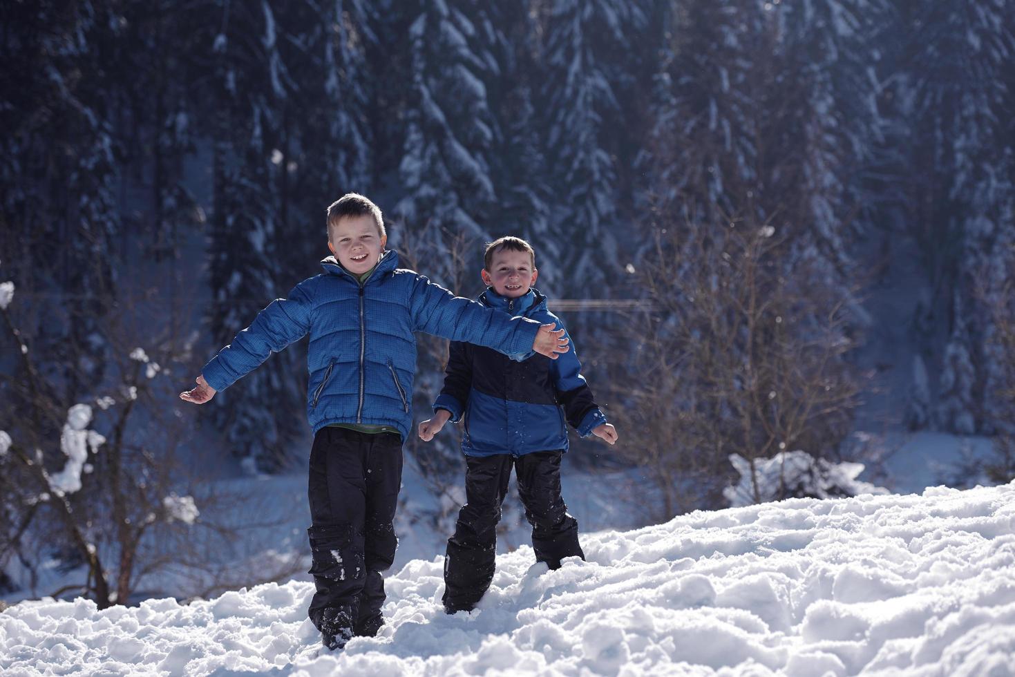 kids playing with  fresh snow photo