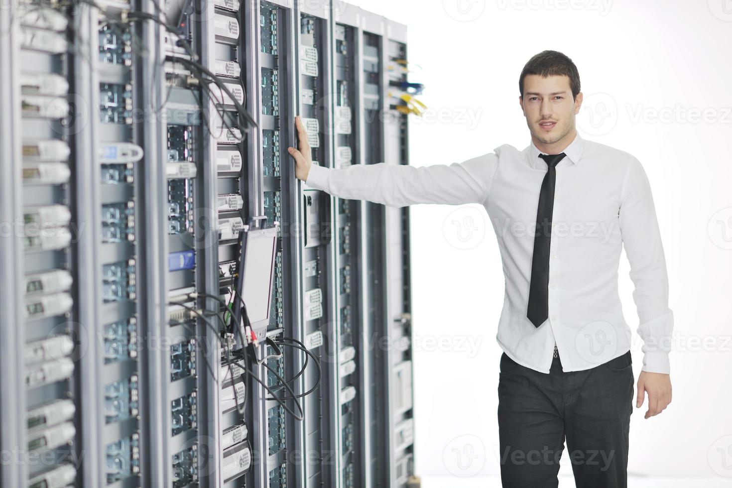 young it engeneer in datacenter server room photo