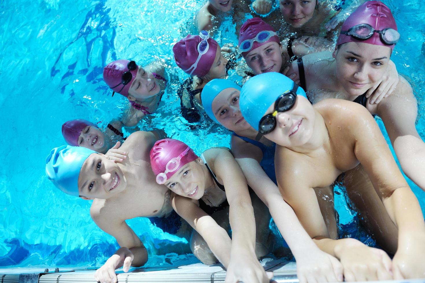 happy children group  at swimming pool photo