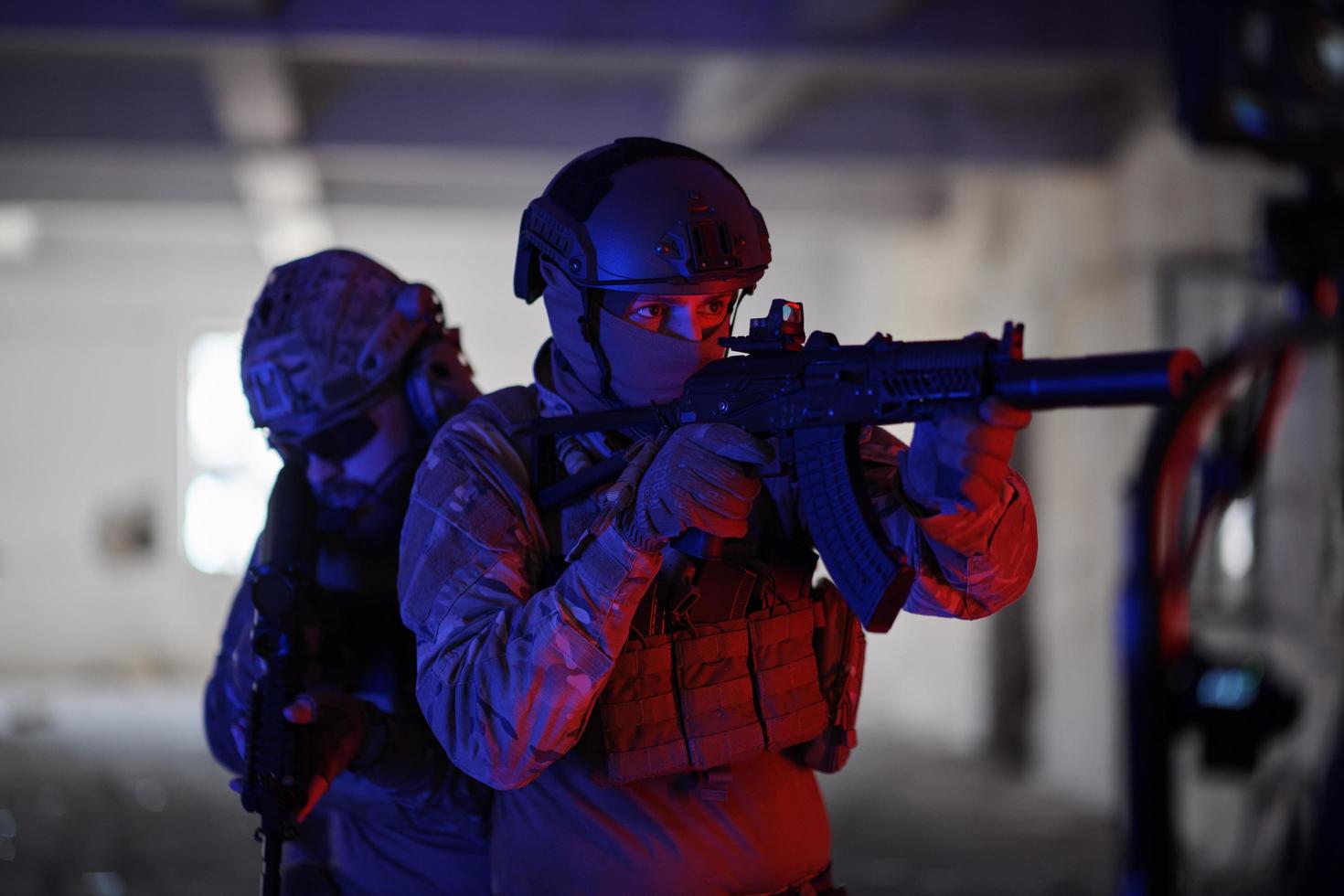 Soldiers squad  in tactical formation  having action urban environment photo