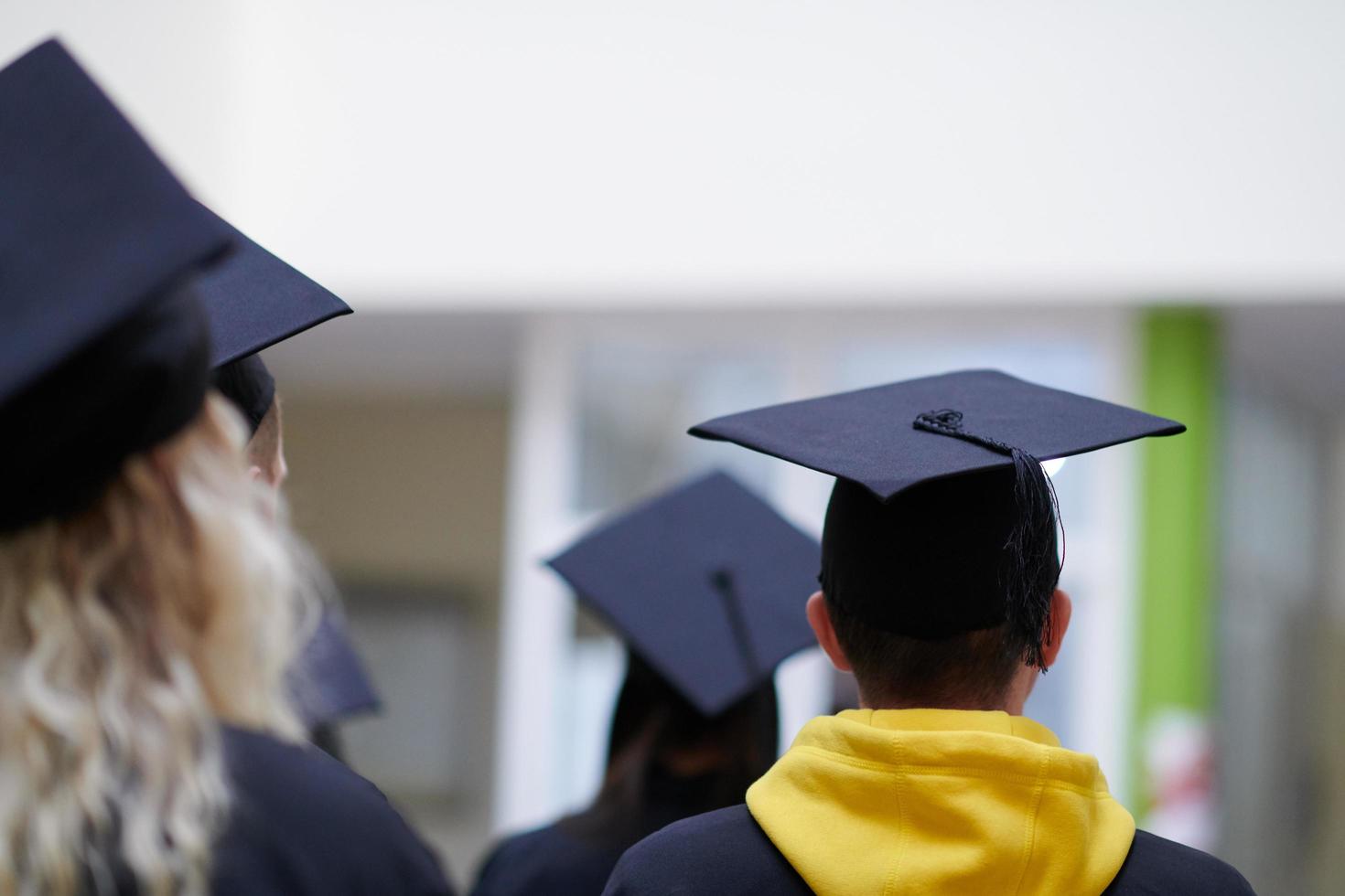 Group of diverse international graduating students celebrating photo