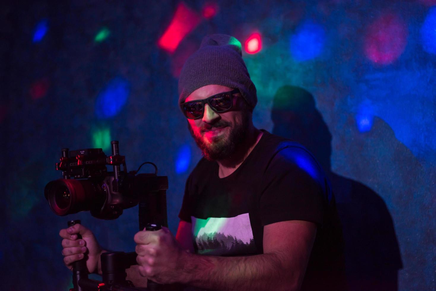 videographer in neon disco party photo