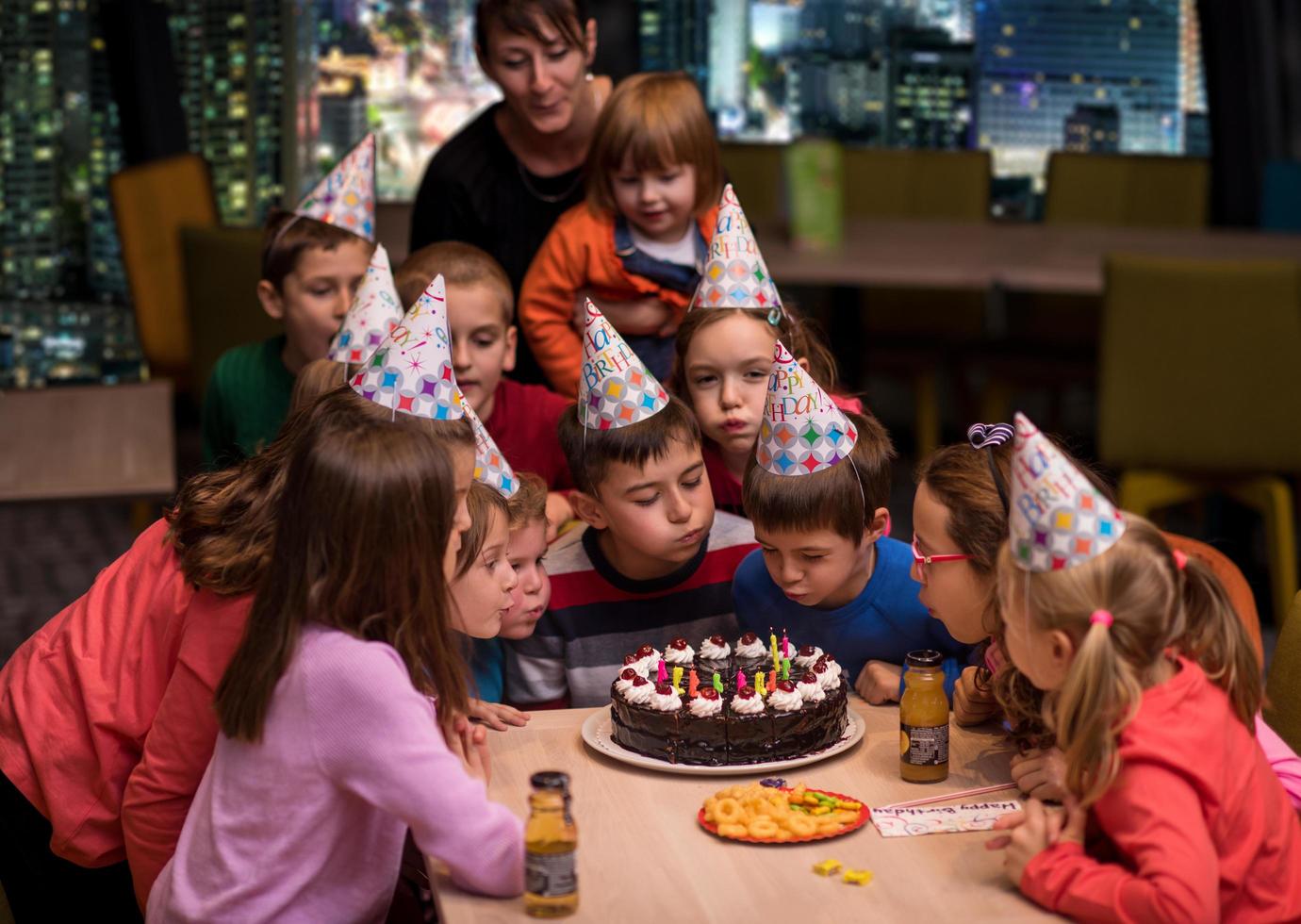 happy young boy having birthday party photo