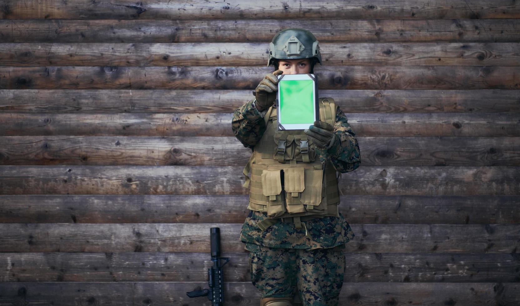 woman soldier using tablet computer photo