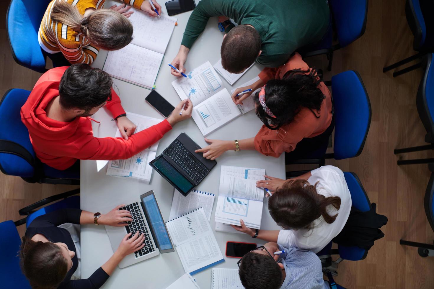 students use modern technology for a school project photo