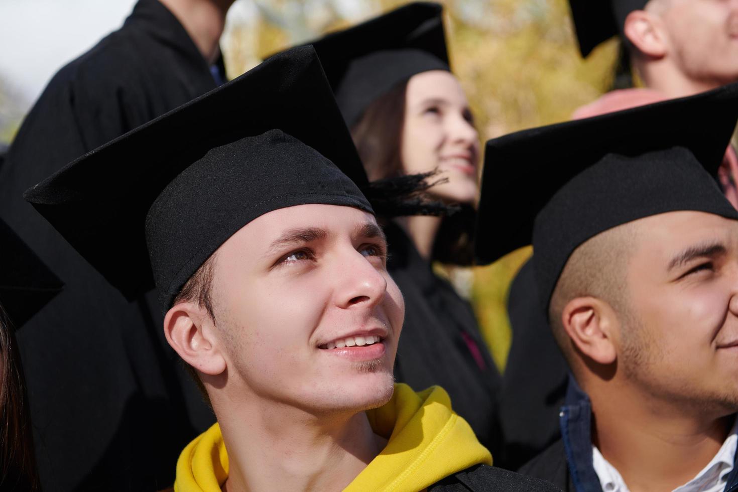 Group of diverse international graduating students celebrating photo