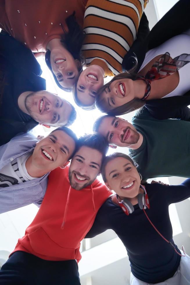 group of happy young people showing their unity photo