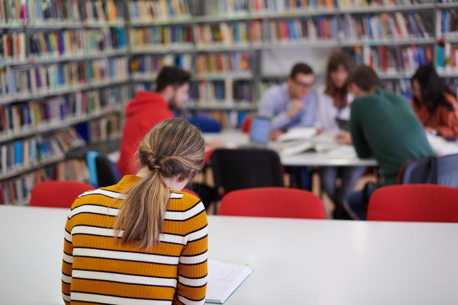 student taking notes for school class photo