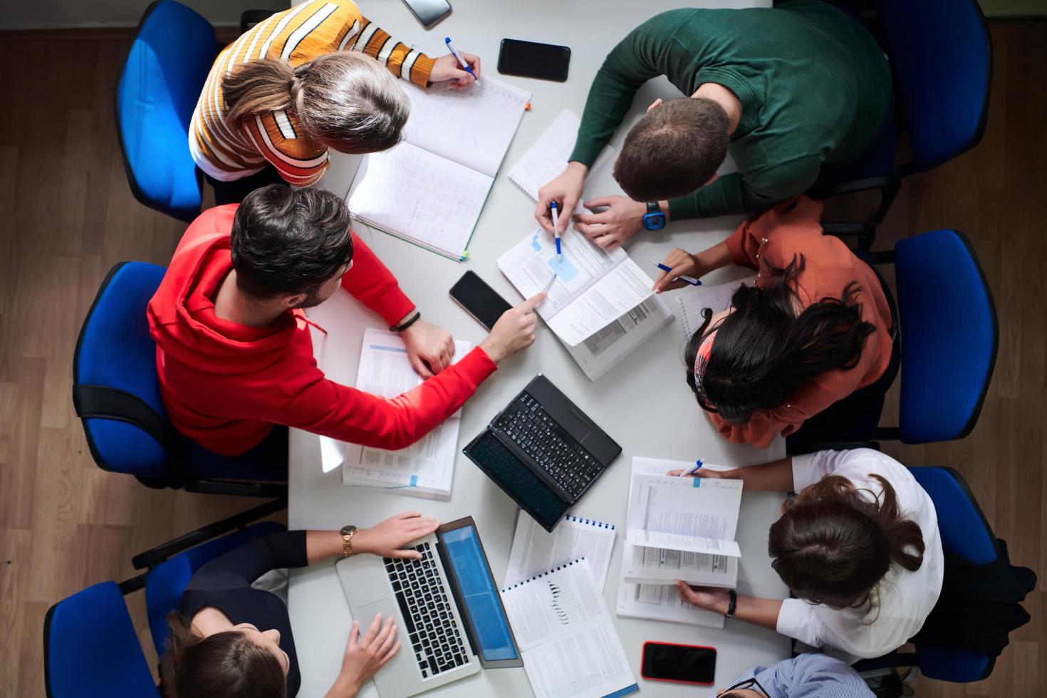 students use modern technology for a school project photo