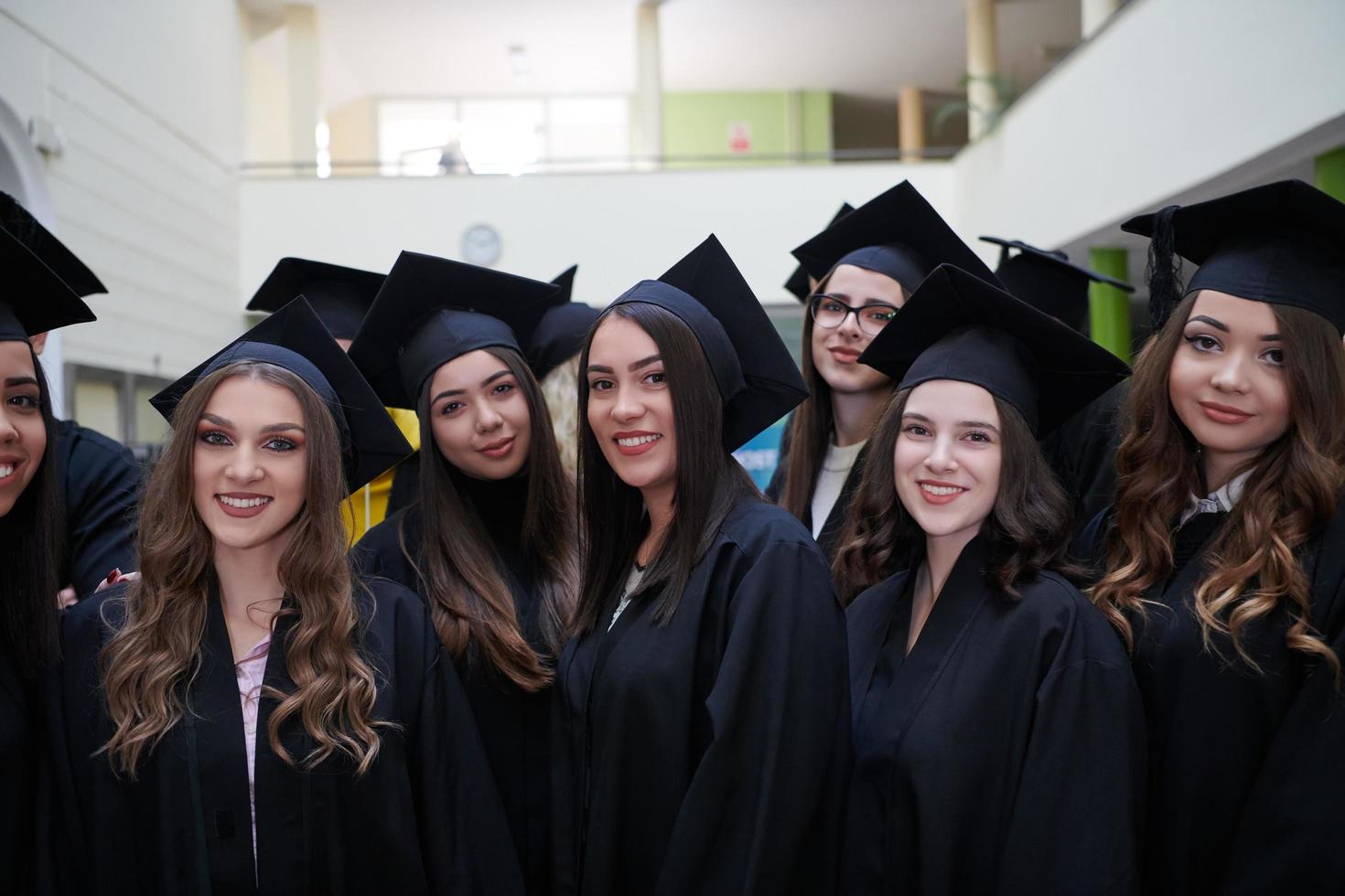 Group of diverse international graduating students celebrating photo