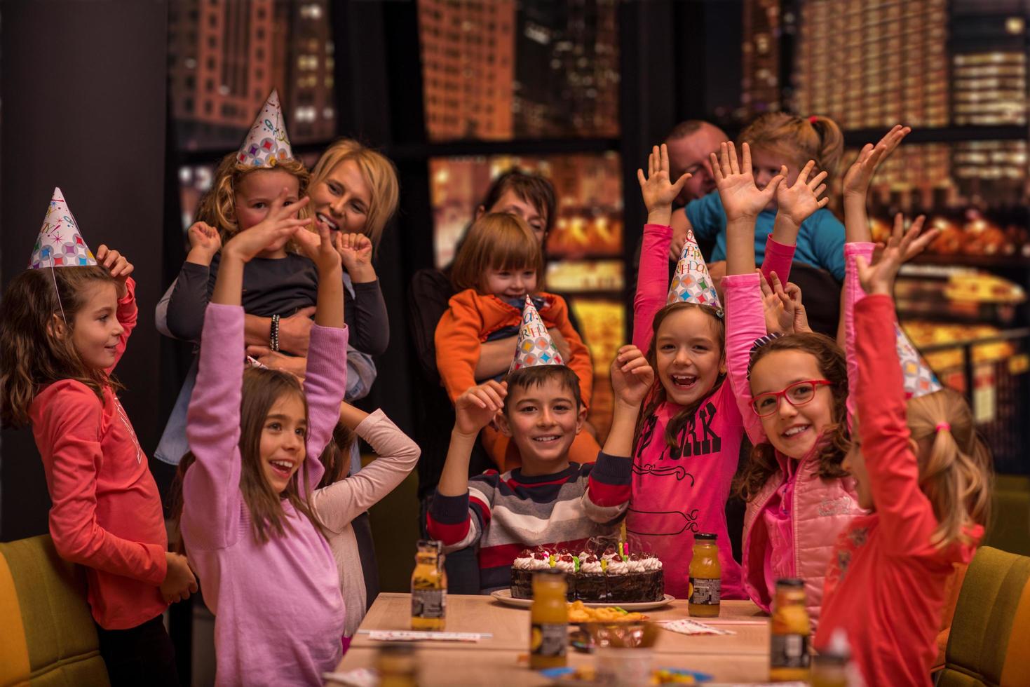 happy young boy having birthday party photo