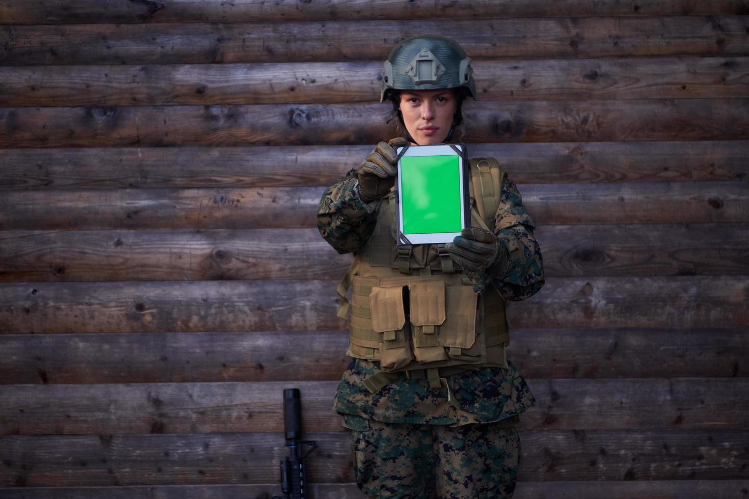 woman soldier using tablet computer photo