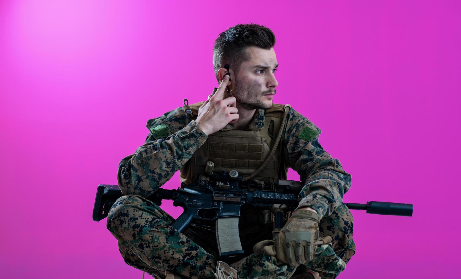 soldier preparing gear for action and checking communication photo