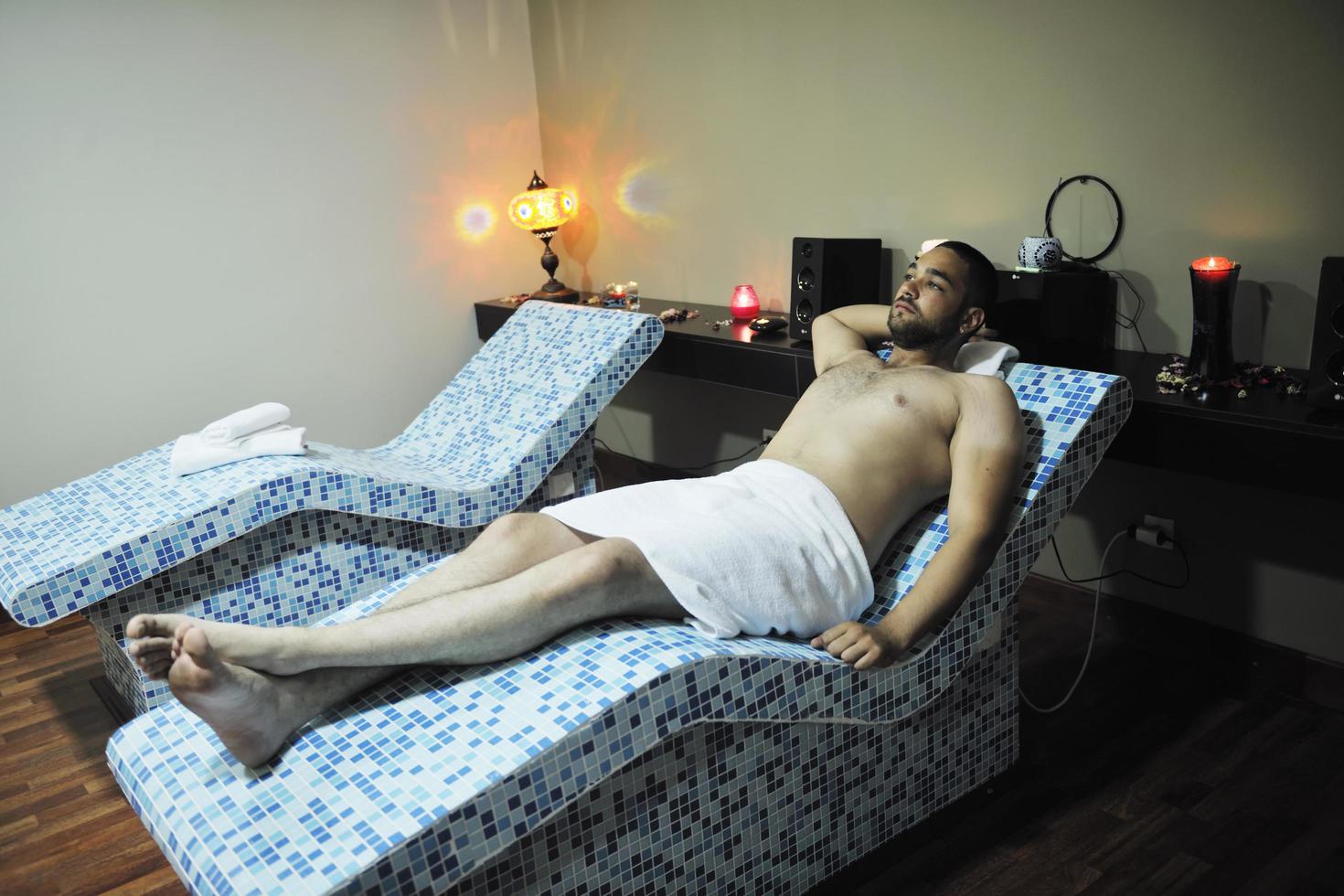 man relaxing at spa photo