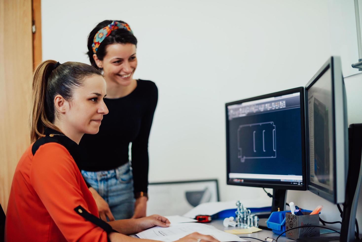 Within the heavy industry, a factory industrial engineer measures with a caliper and on a personal computer Designs a 3D model photo