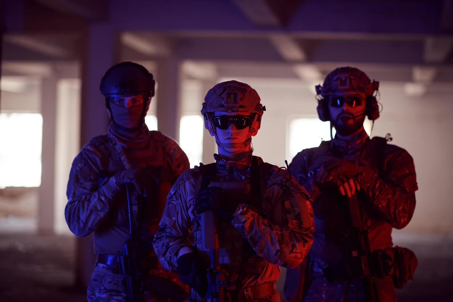 soldier squad team portrait in urban environment colored lightis photo