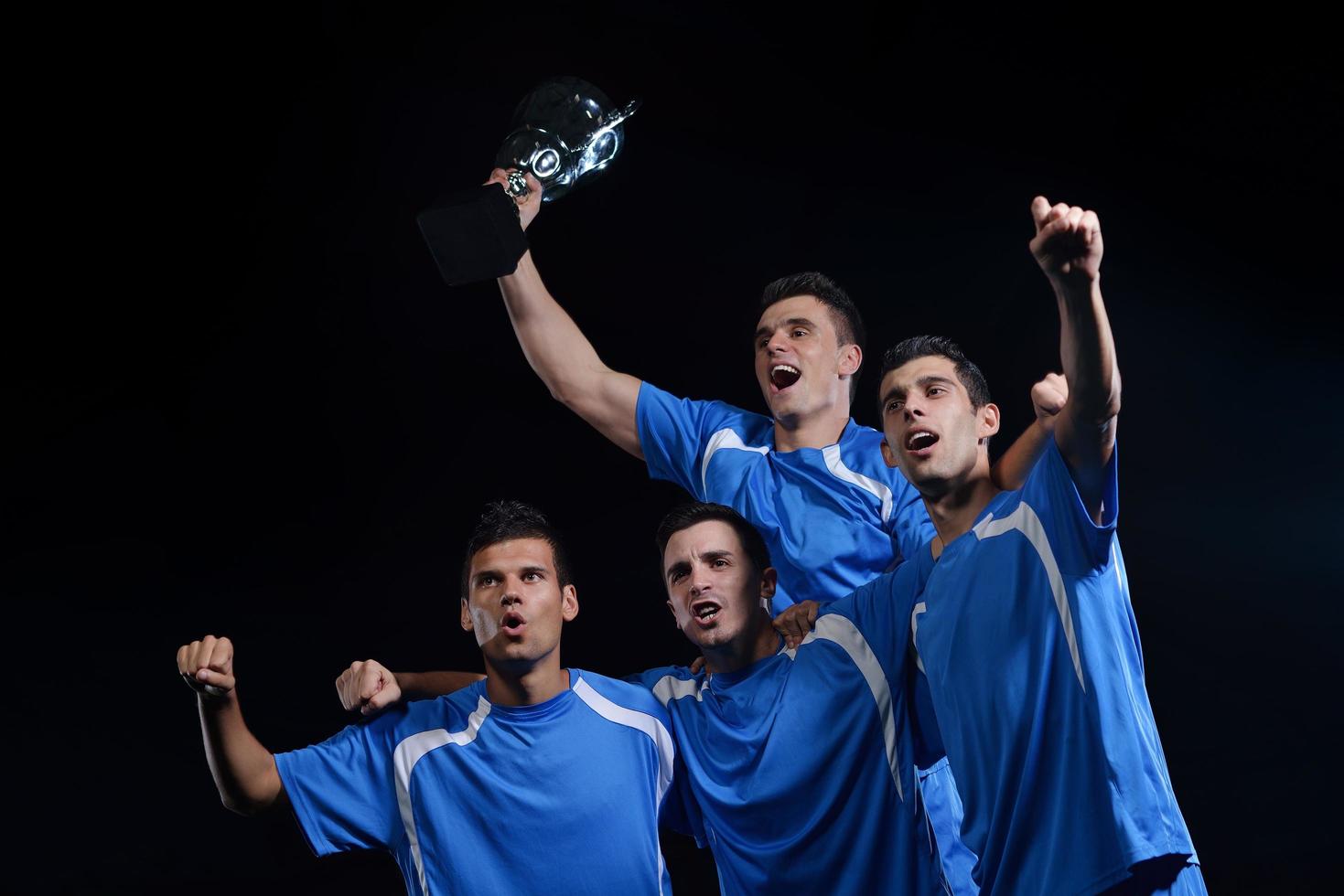 soccer players celebrating victory photo