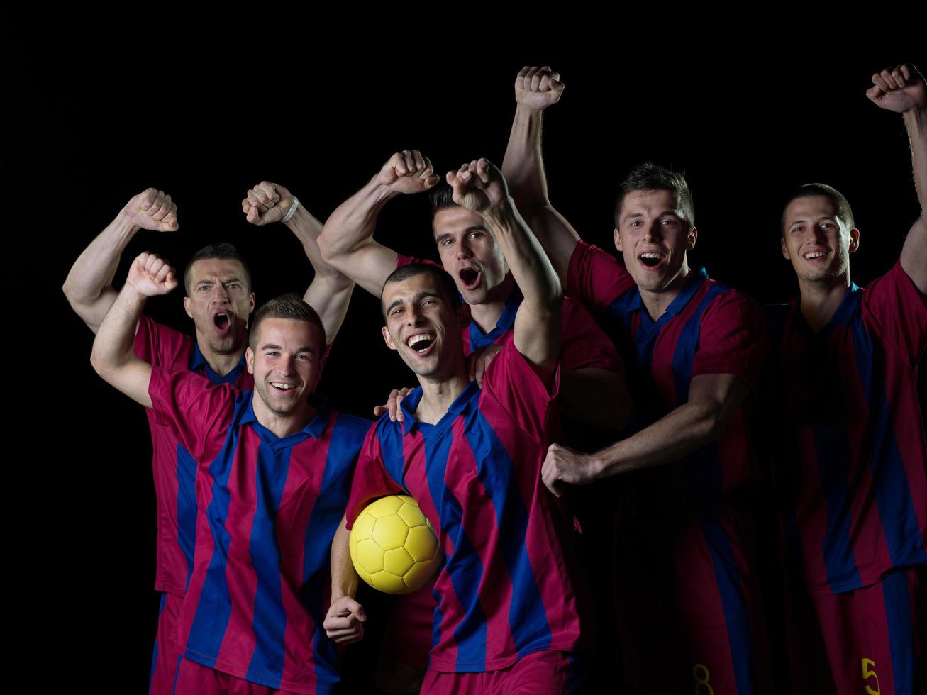 soccer players celebrating victory photo