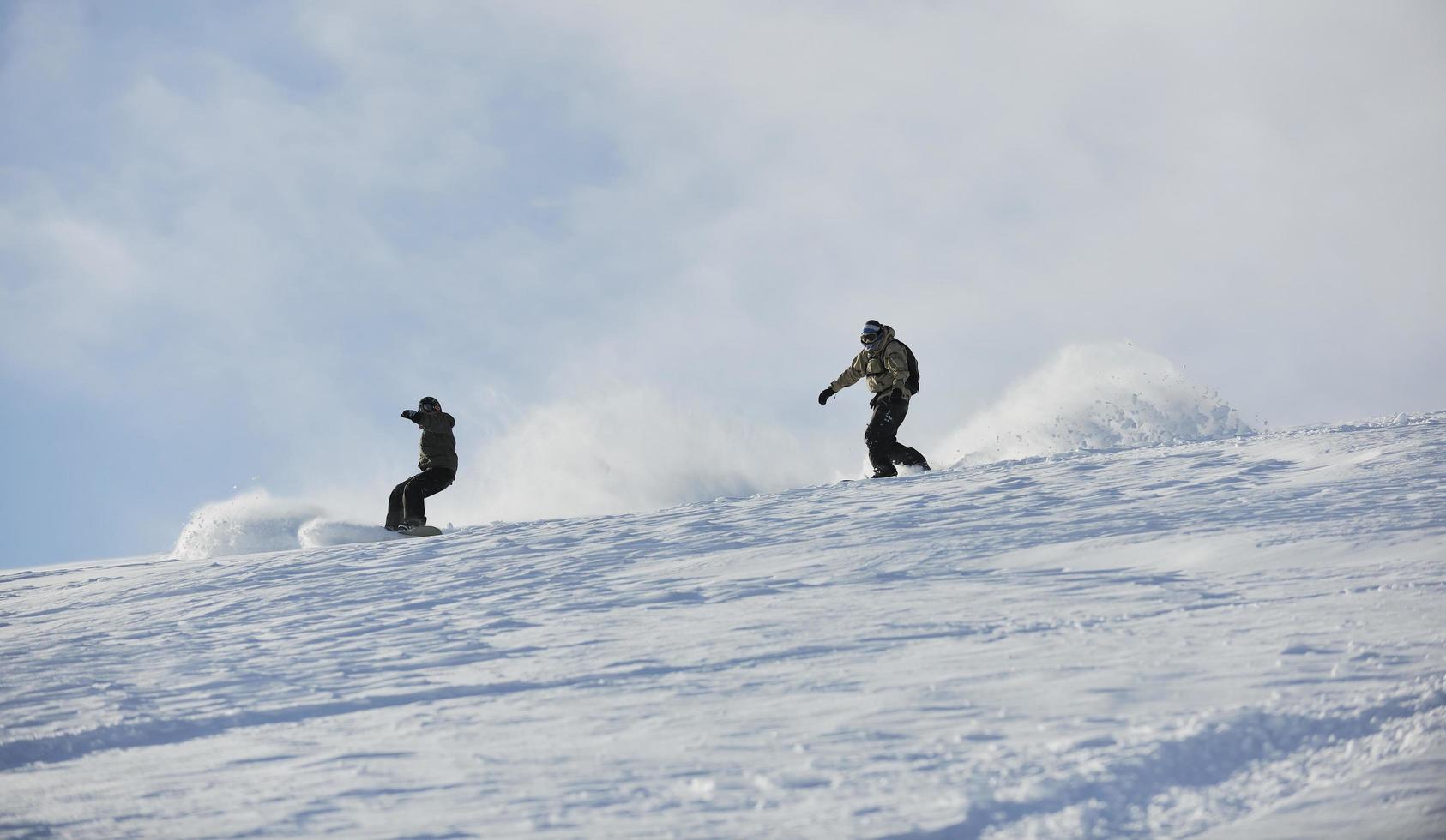 freestyle snowboarder jump and ride photo