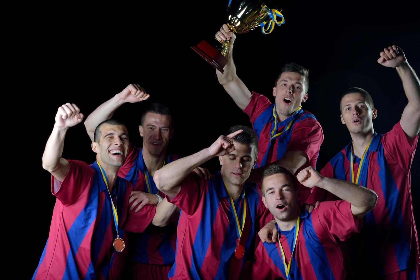 soccer players celebrating victory photo