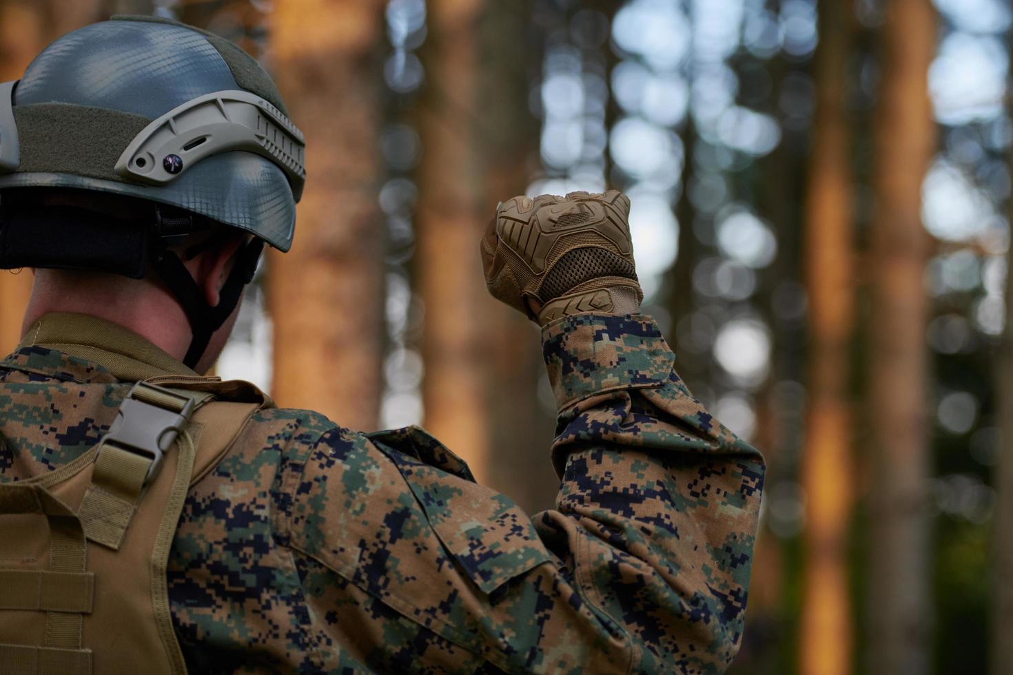 officer is  showing tactical hand signals photo