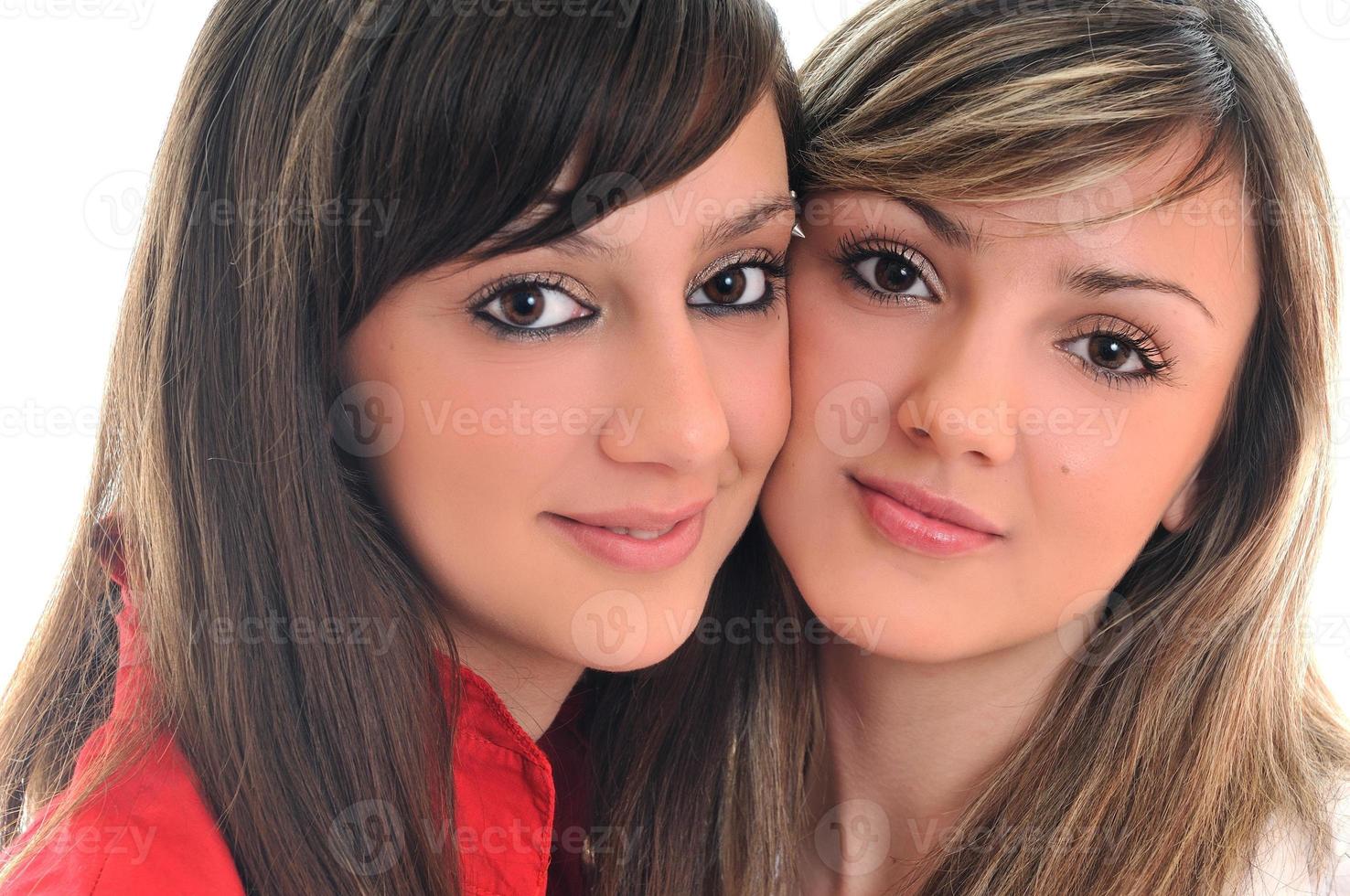 two young girls isolated on white photo