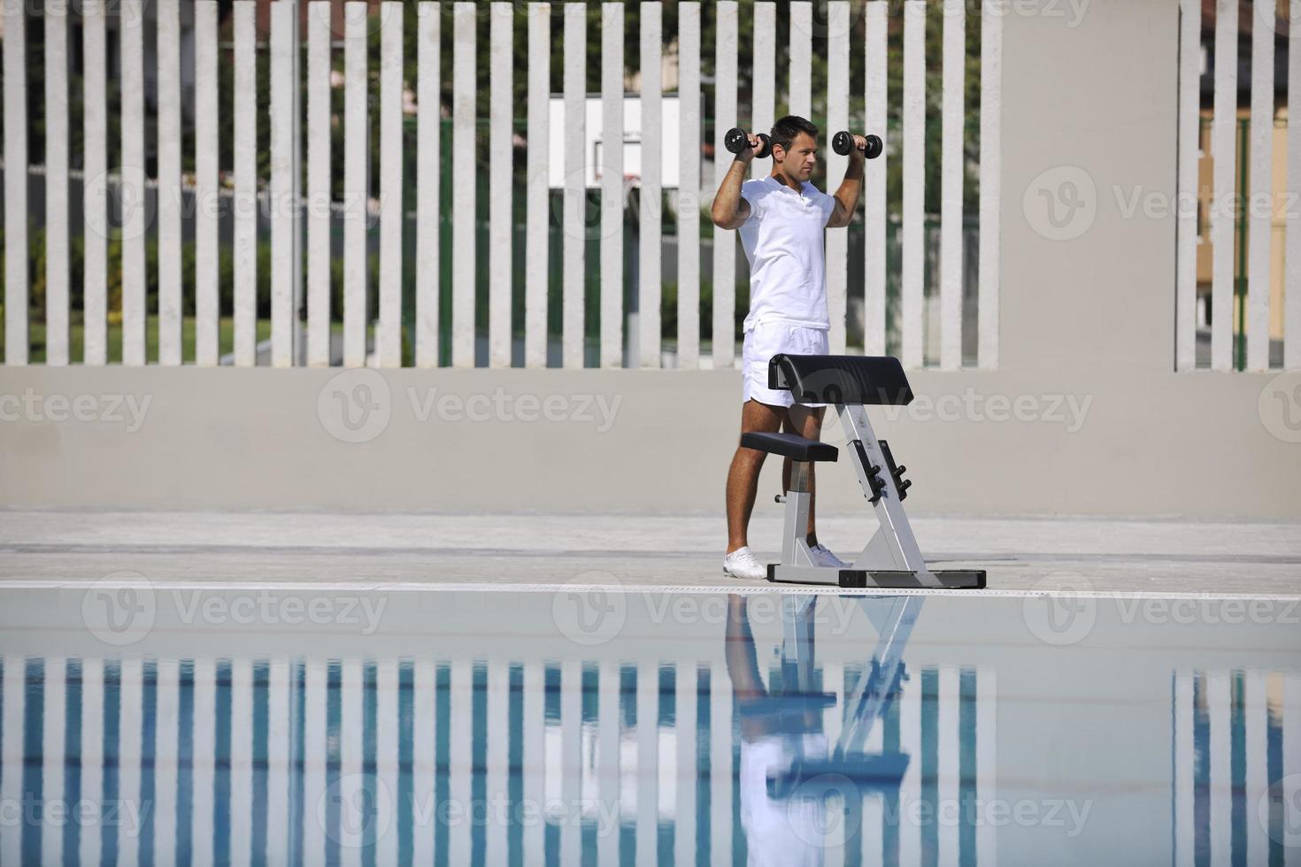 Exercising by pool photo