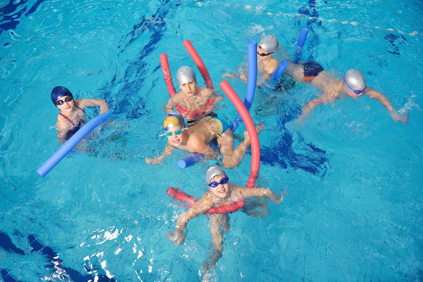 happy children group  at swimming pool photo