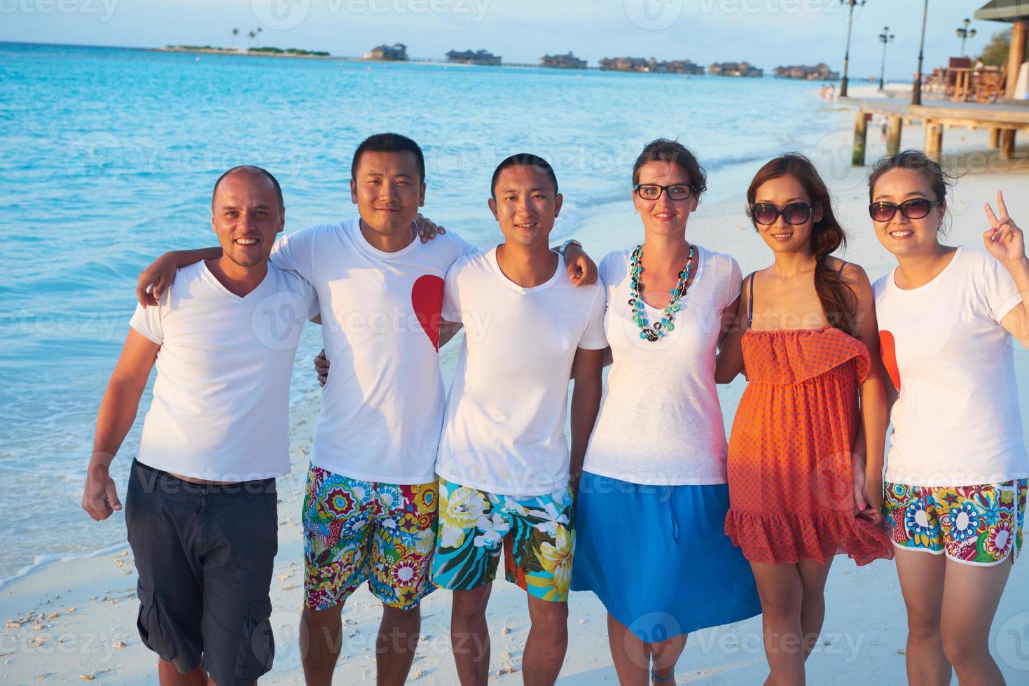 group of friends on beautiful beach photo