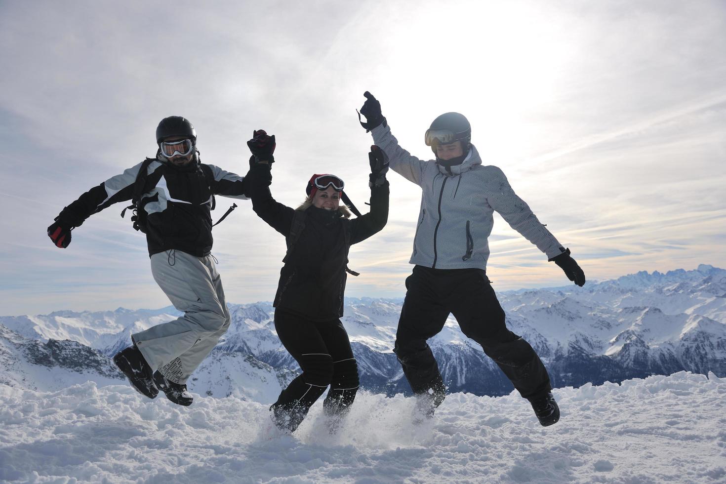 people group on snow at winter season photo